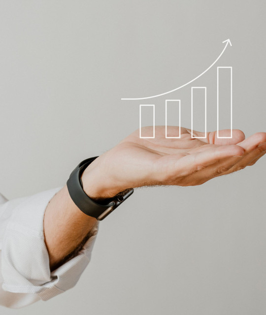 digital-increasing-bar-graph-with-businessman-hand-overlay